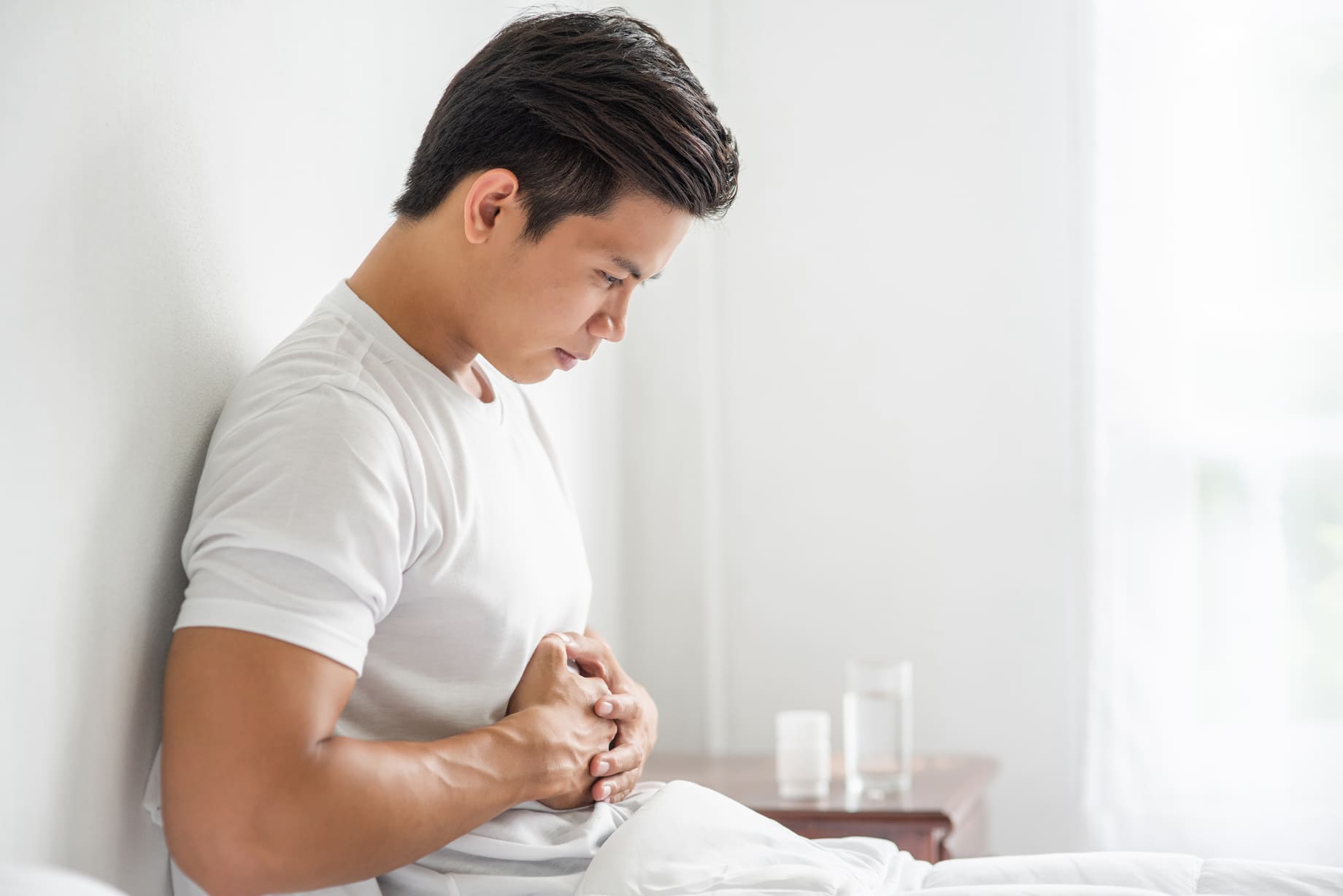 Man with gastroparesis holding his stomach