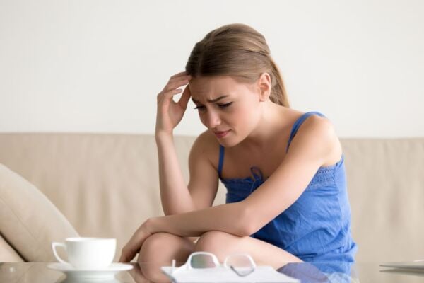 Depress woman with heartburn