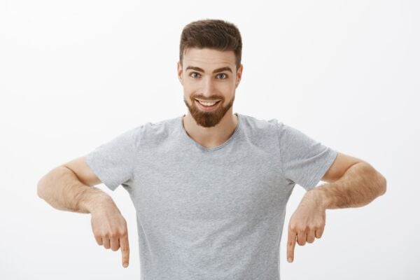 Man pointing his fingers down