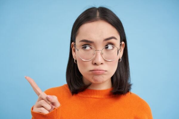 Women pointing her finger sideward