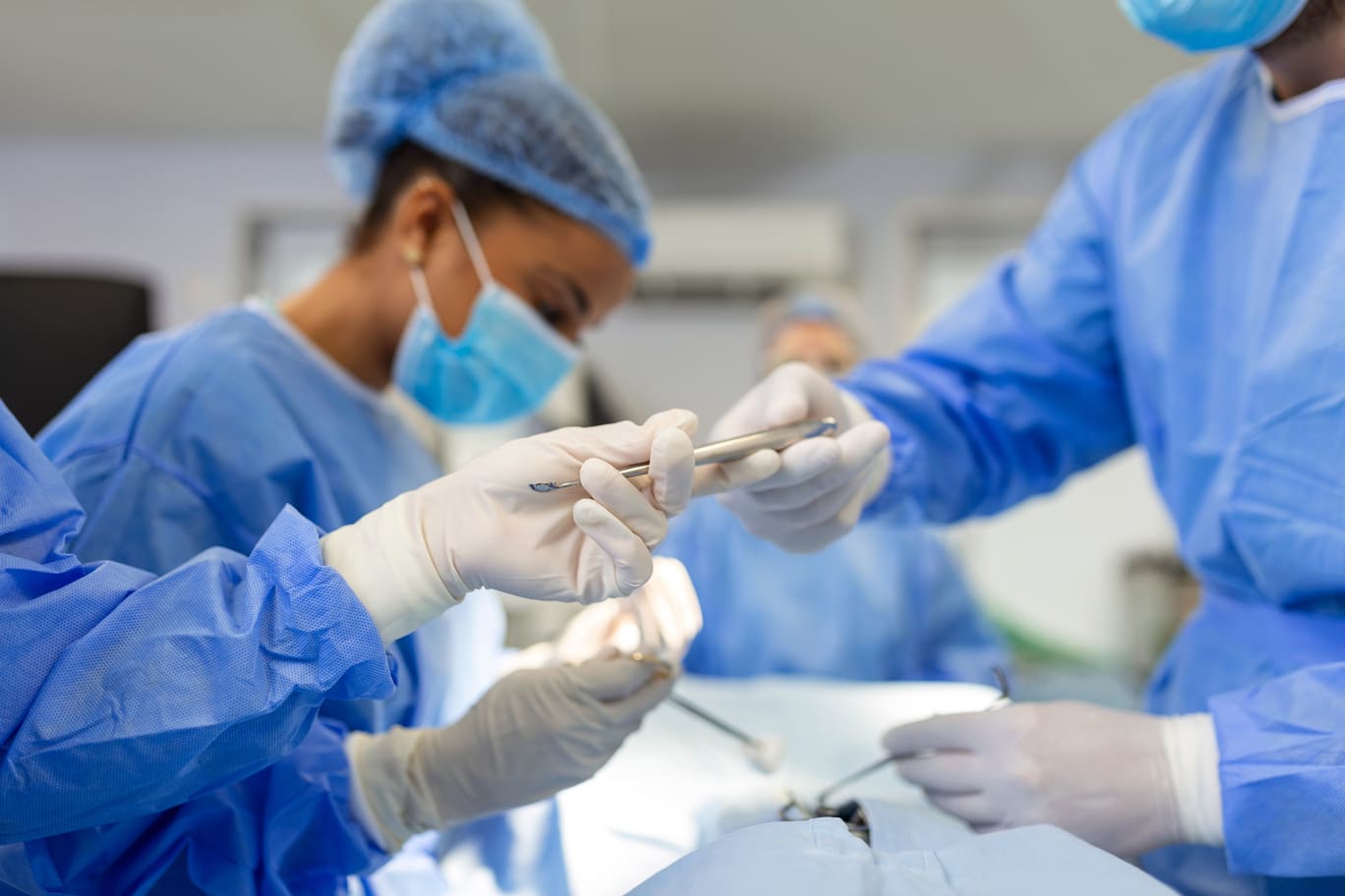 Hiatal Hernia Doctors handing out equipments inside operation room