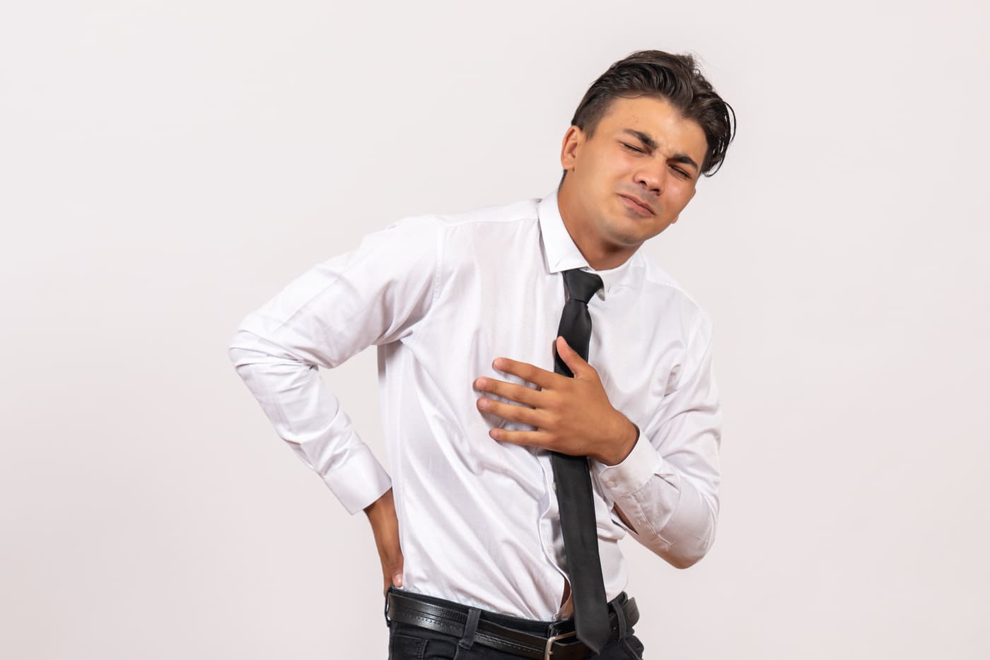 Man with acid reflux suffering from back pain