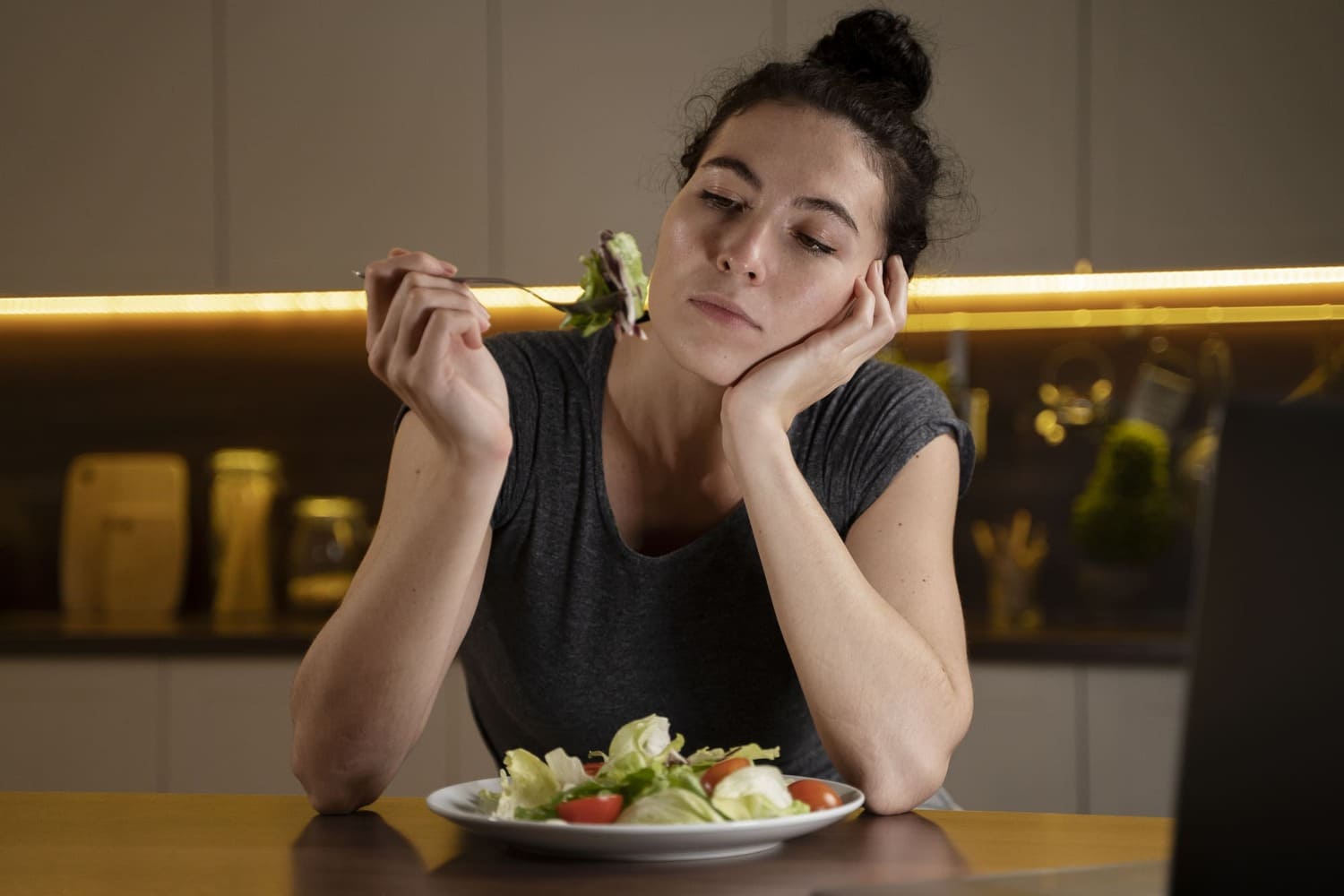 Women with heartburn eating vegetable