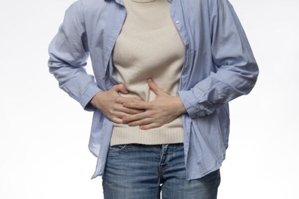 Person with gastroparesis holding his stomach