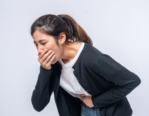 Woman vomiting because of gastroparesis