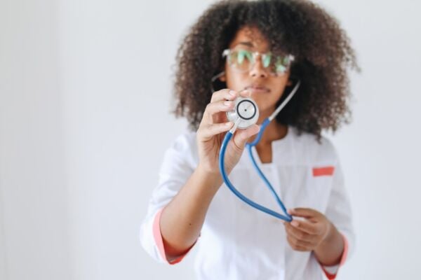A doctor preparing to inspect a patient with hiatal hernia