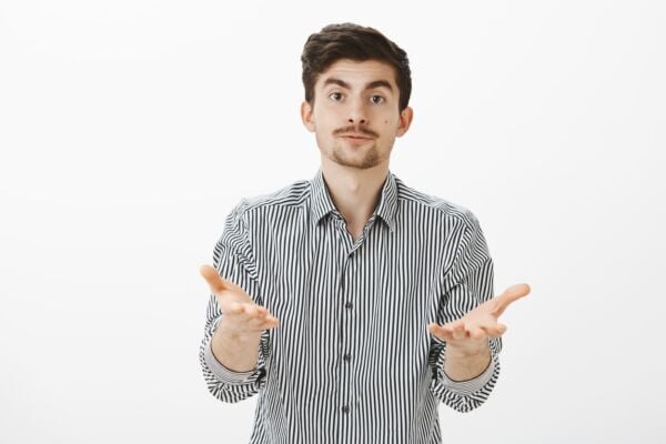 Man with gastroparesis his hands raised, palms up