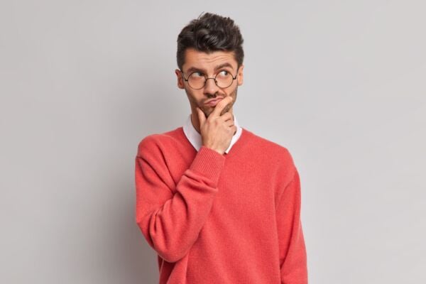 Man with heartburn wondering