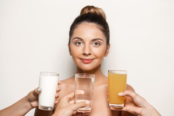 Women holding juice and water