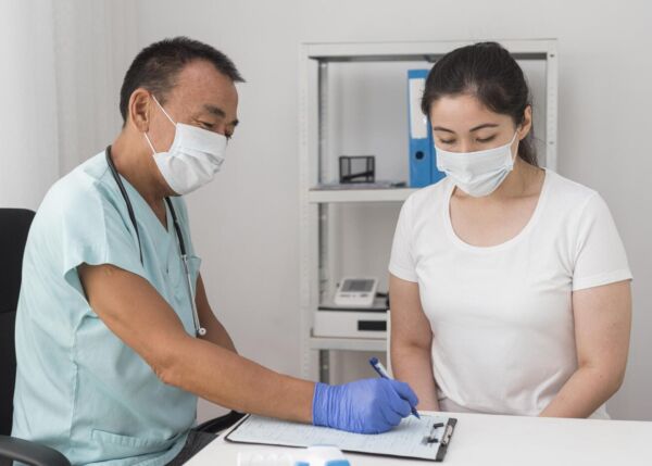 Gastroenterologist explaining treatment to a patient