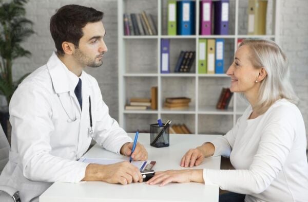 Patient with acid reflux consulting a doctor