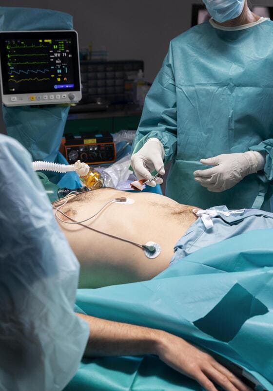Doctors and heartburn patient in an operating room