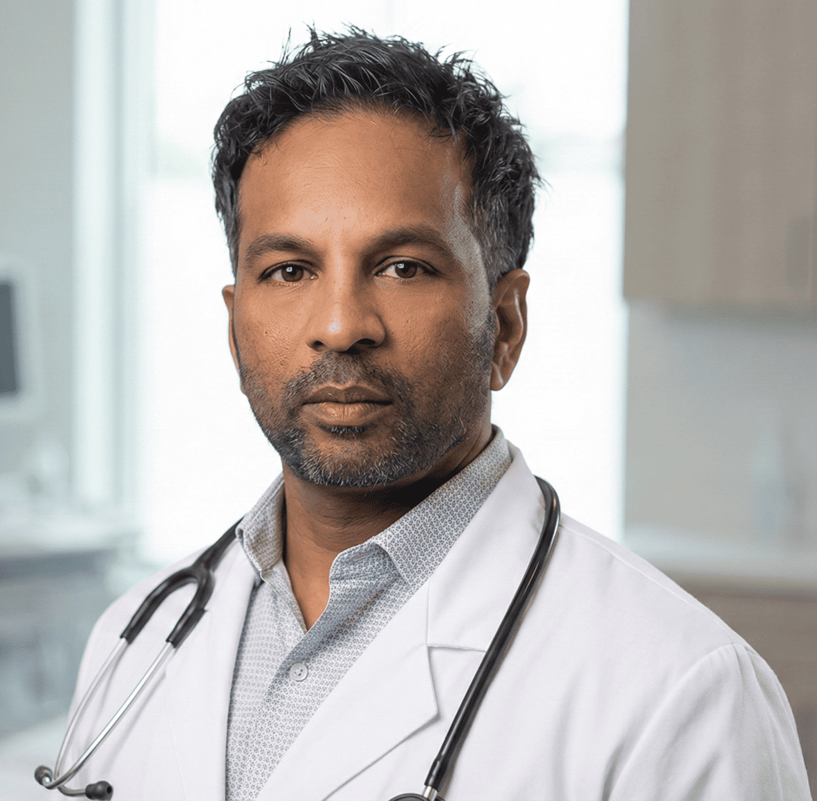 Dr. Grandhige wearing white coat