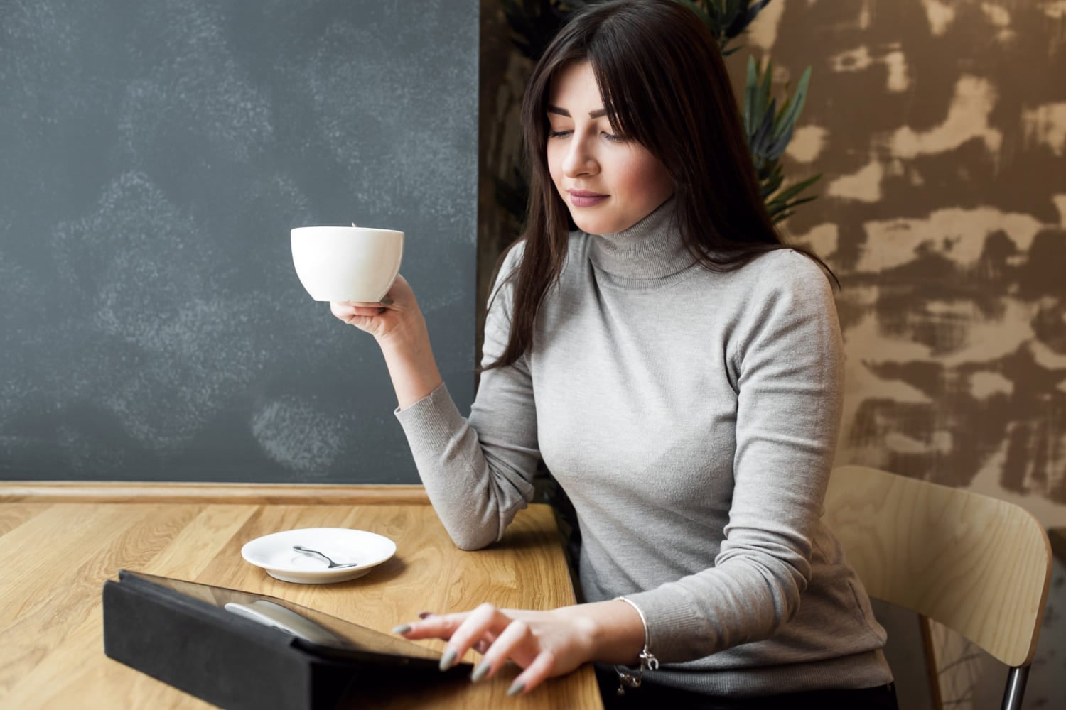 Woman with coffee cup concerned about acid reflux symptoms