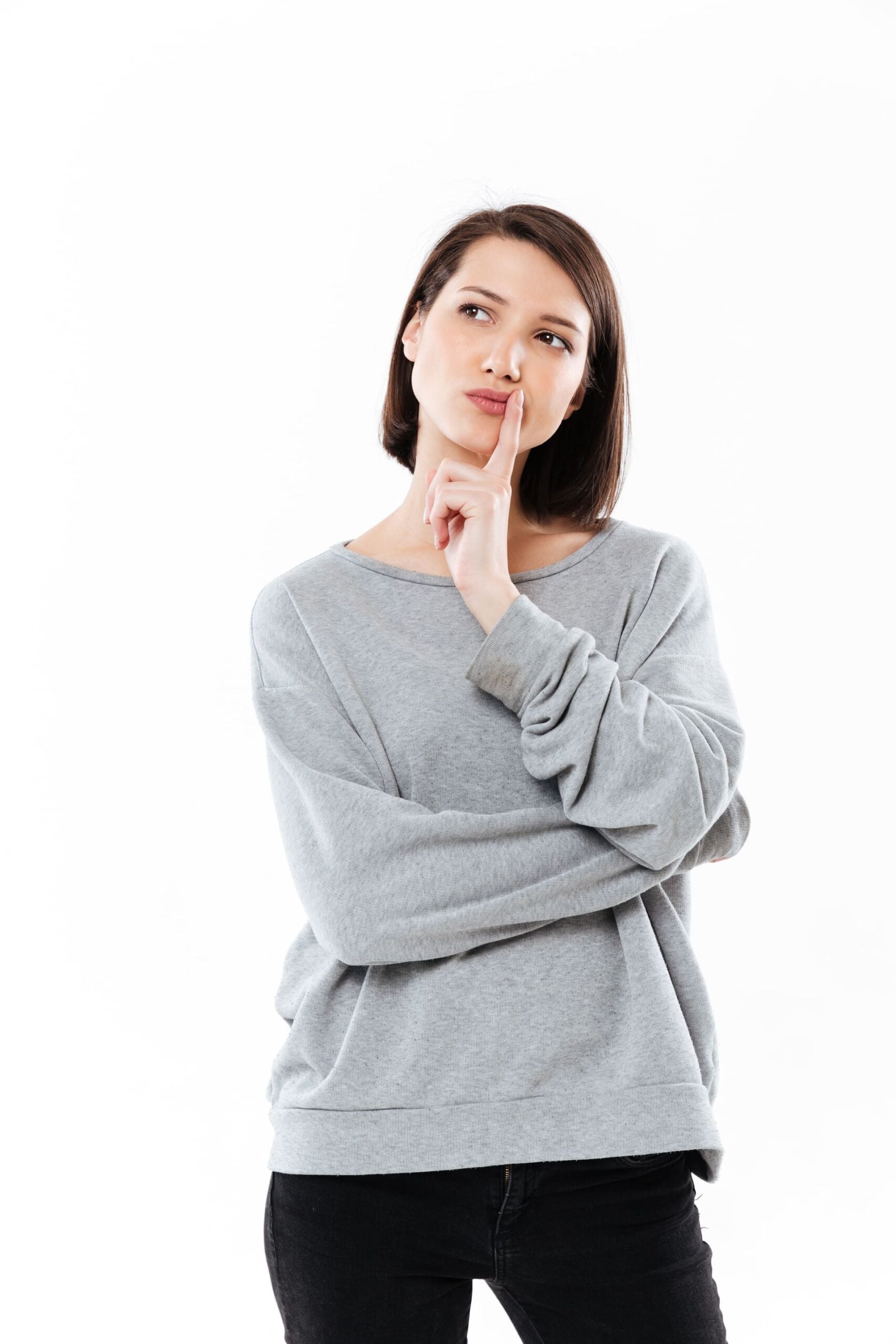 Woman with her pointing finger in her chin