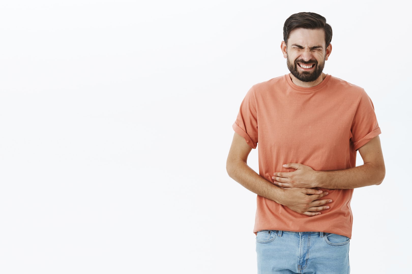 Man with gastroparesis in pain holding his stomach