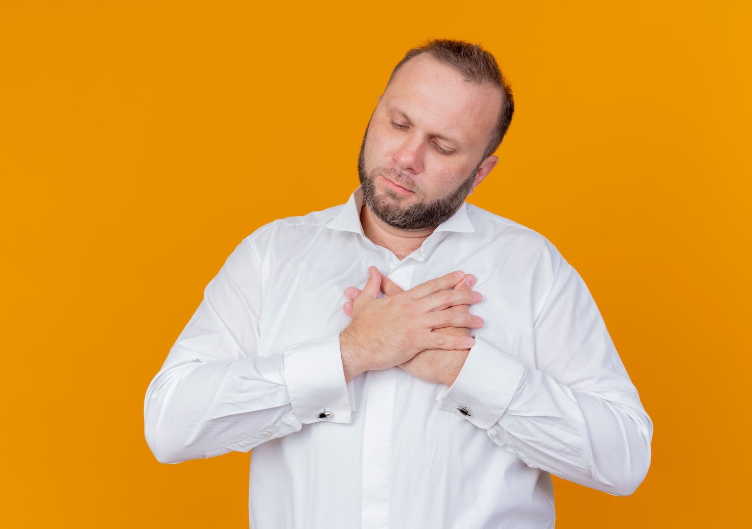 Man with heartburn both hands holding chest