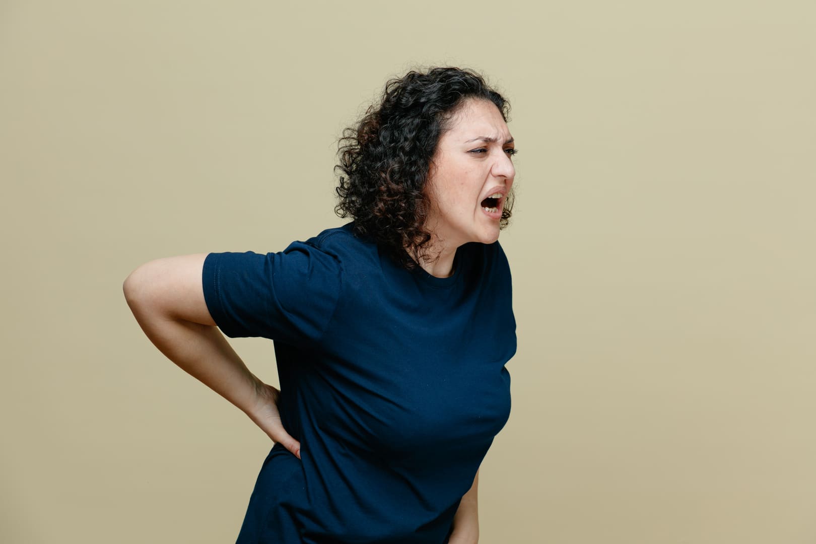 Woman with back pain because of GERD