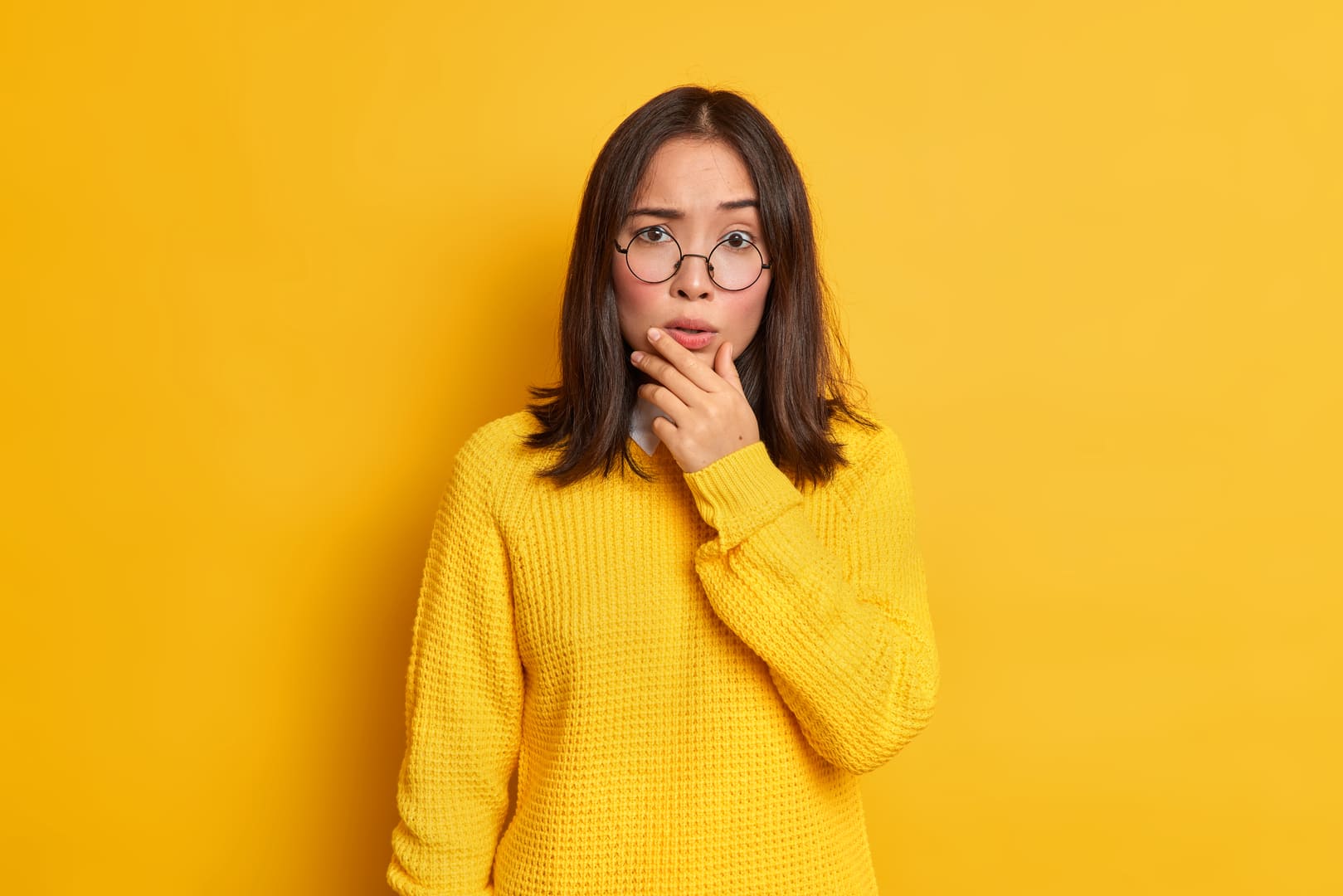 Woman with heartburn wondering about GERD