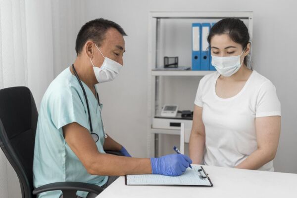 Patient with hiatal hernia consulting a doctor