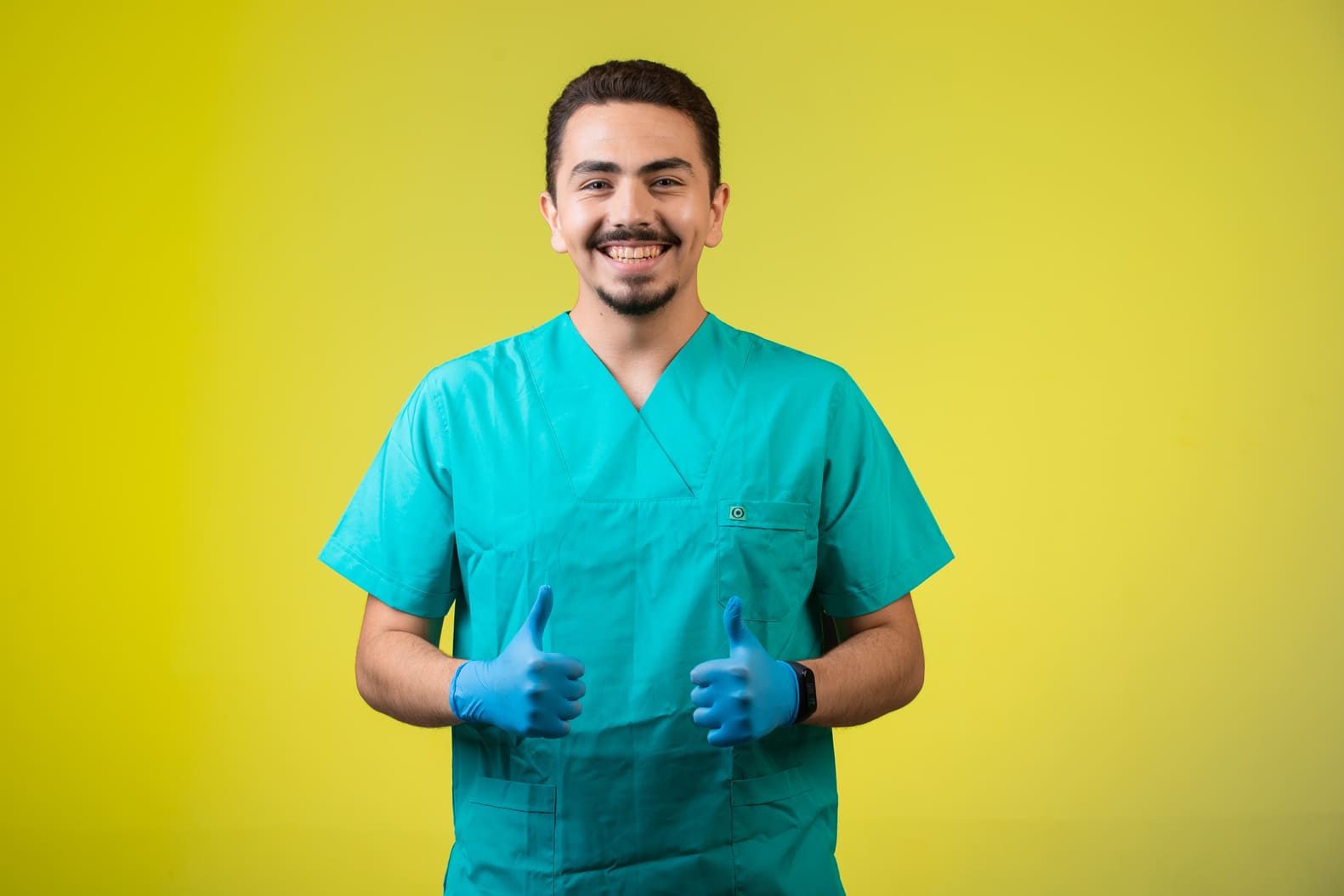 Heartburn surgeon smiling with thumbs up gesture