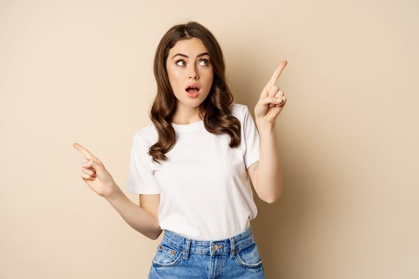 Woman with heartburn pointing her fingers