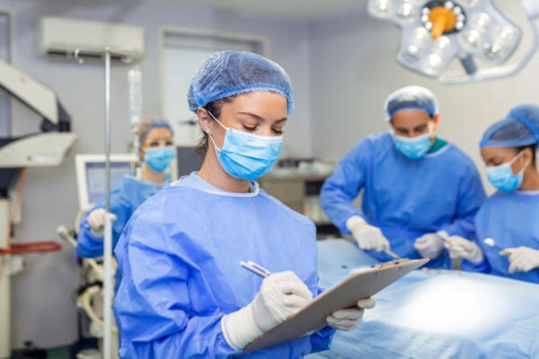 Hiatal hernia surgeon writing something on clipboard