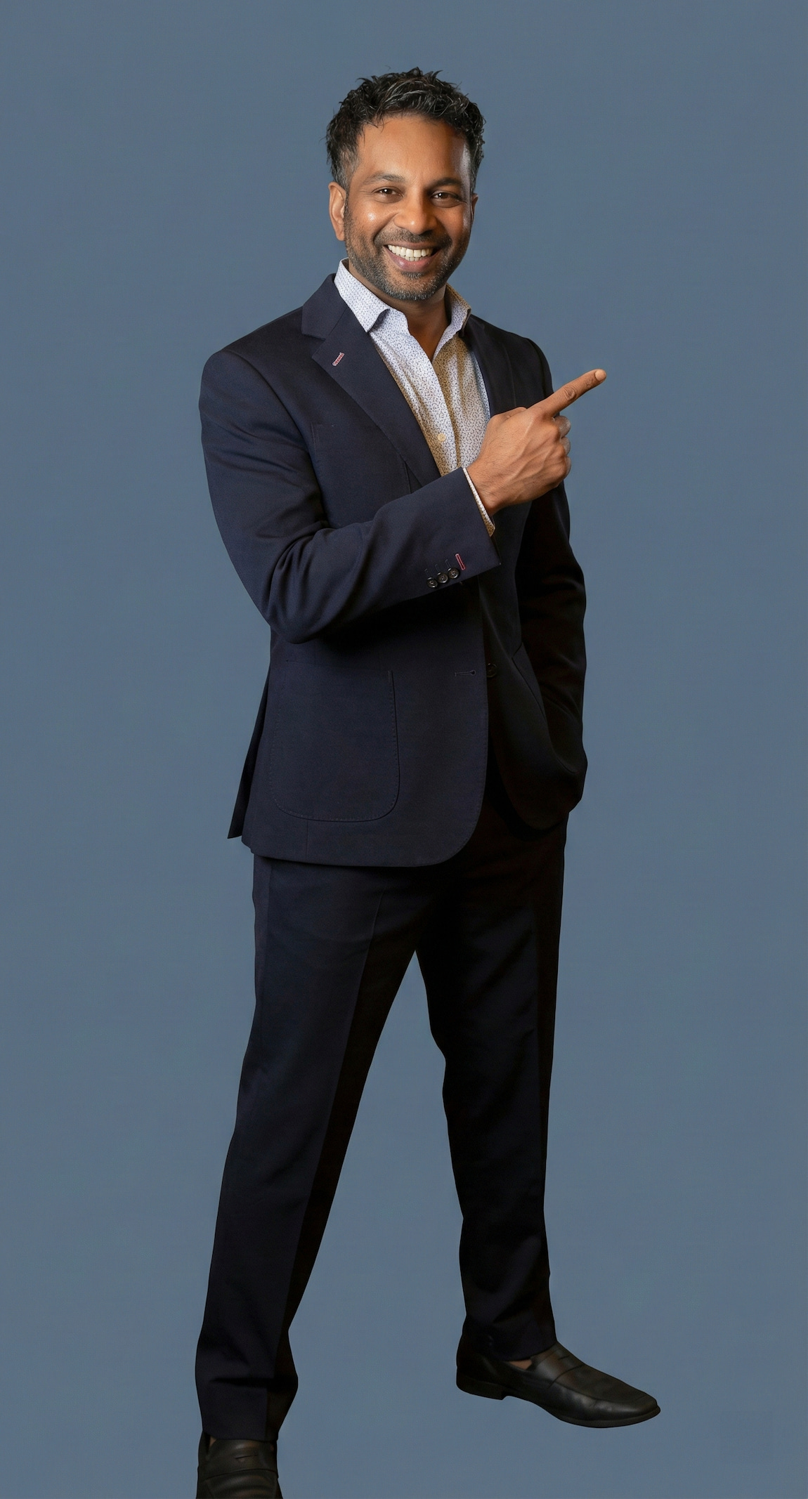 Dr. Grandhige standing pointing to the right