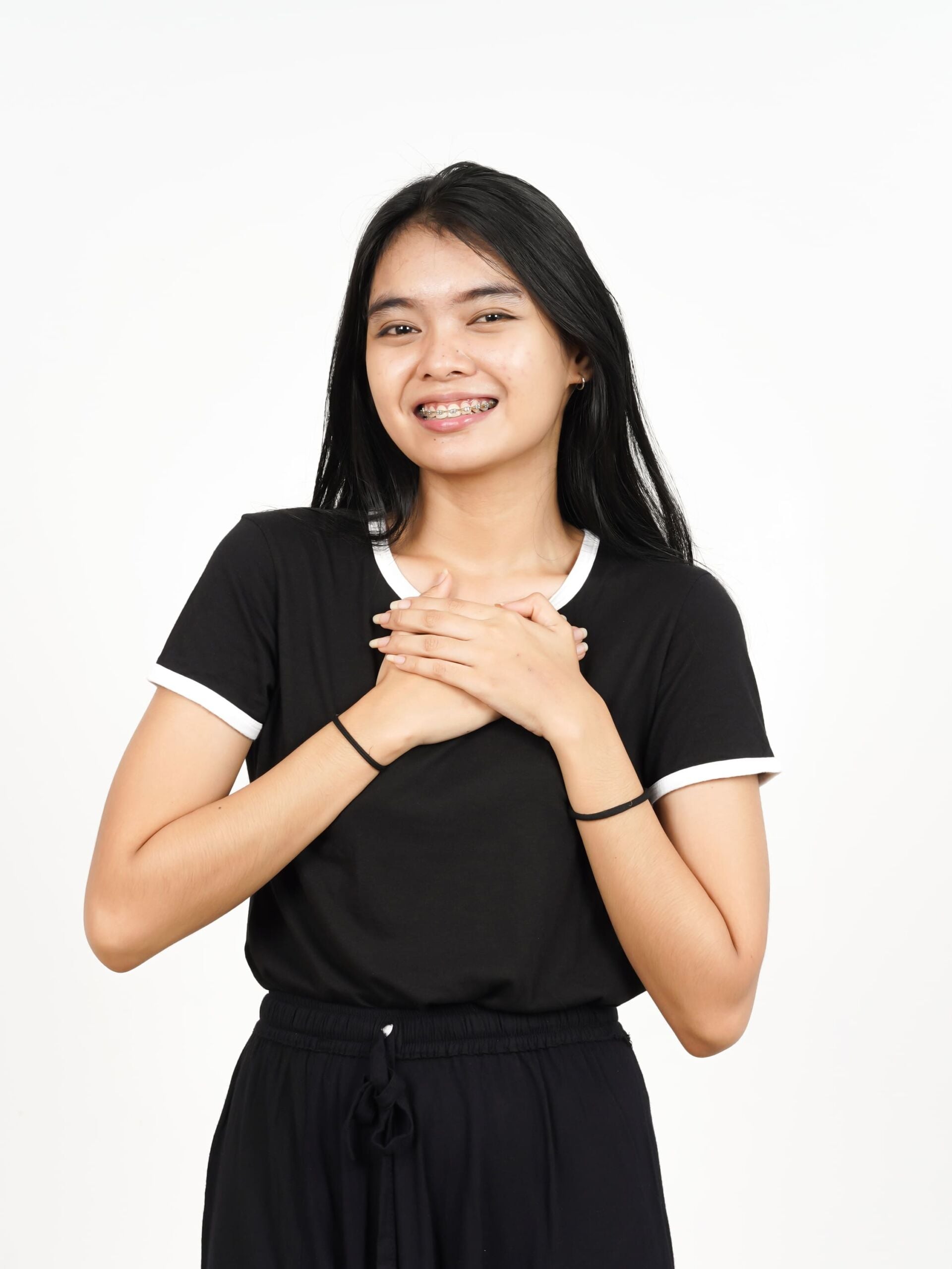 Happy women both hands holding chest