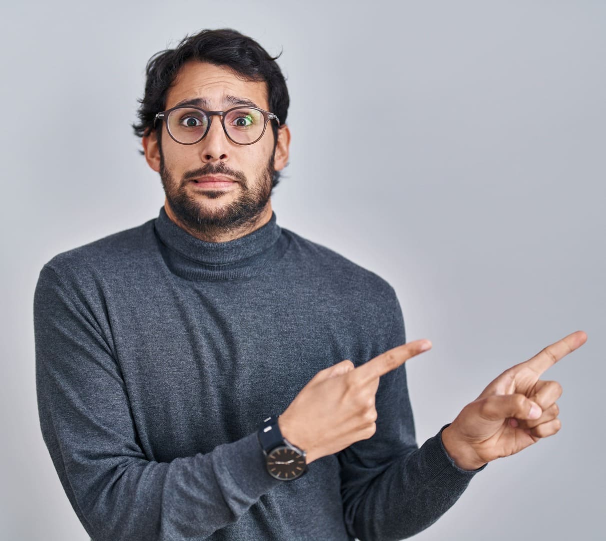 Man with hiatal hernia worried pointing right