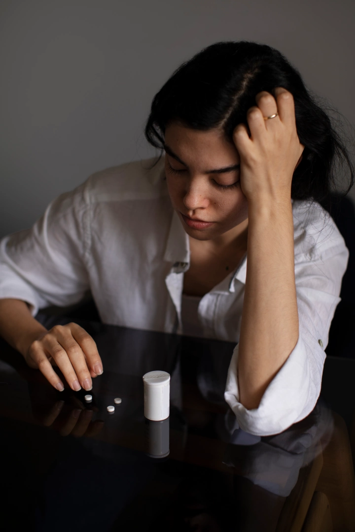 Women with hiatal hernia looking at pills Women with hiatal hernia looking at pills