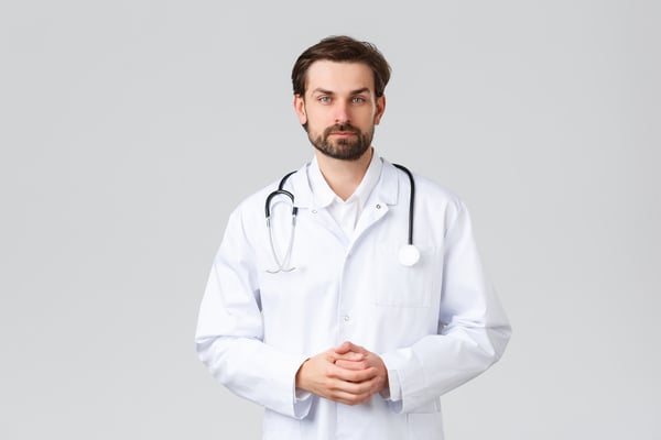 Heartburn doctor with his hands clasped