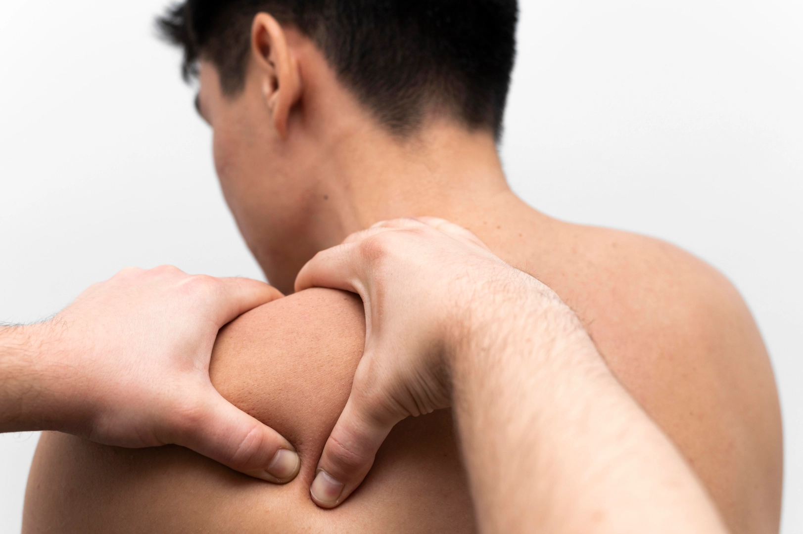 Man getting massage on shoulder blade