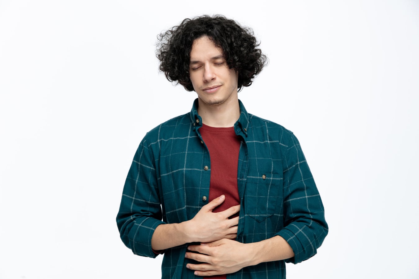 Man with gastroparesis holding stomach while closed eyes