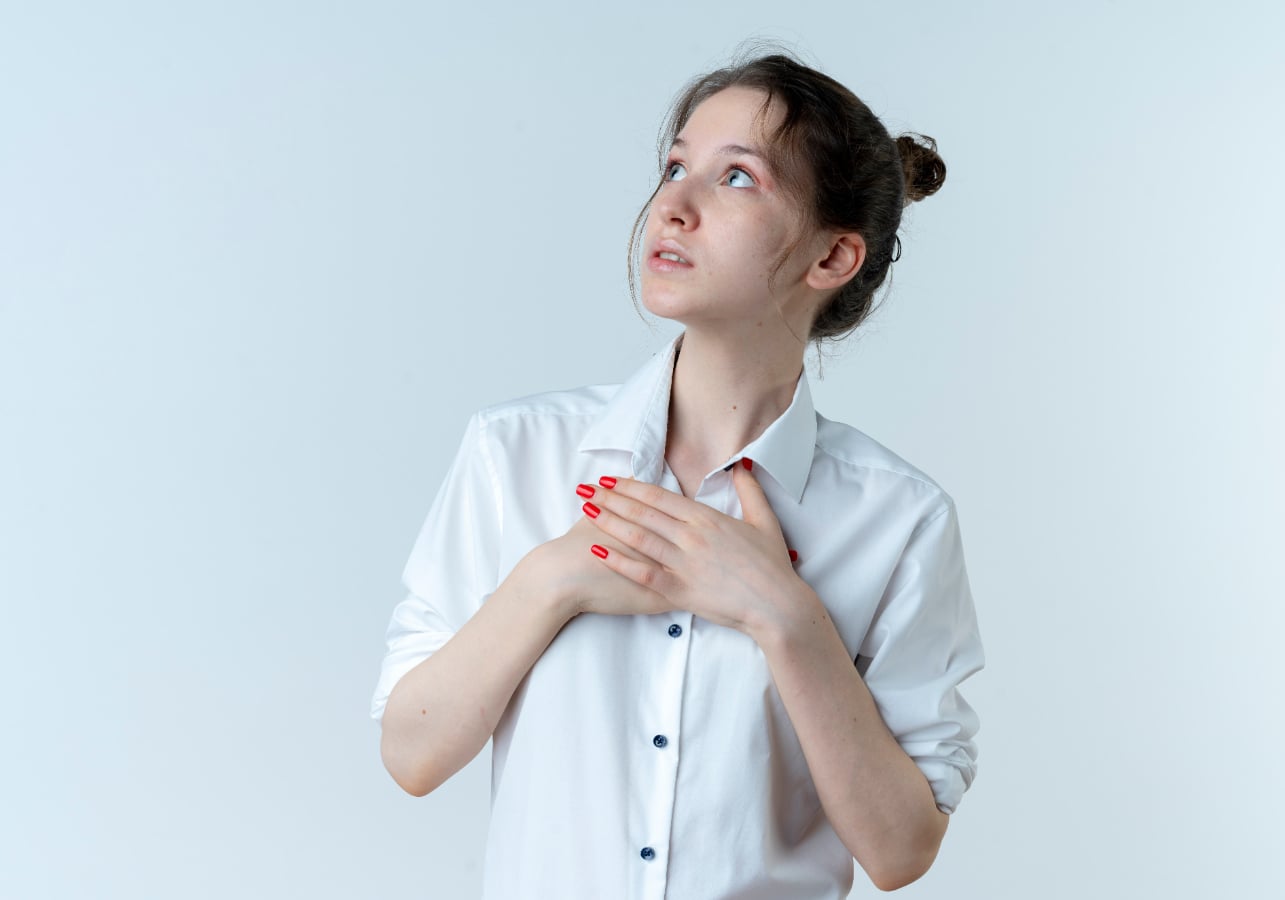 Woman with hiatal hernia tightly holding chest