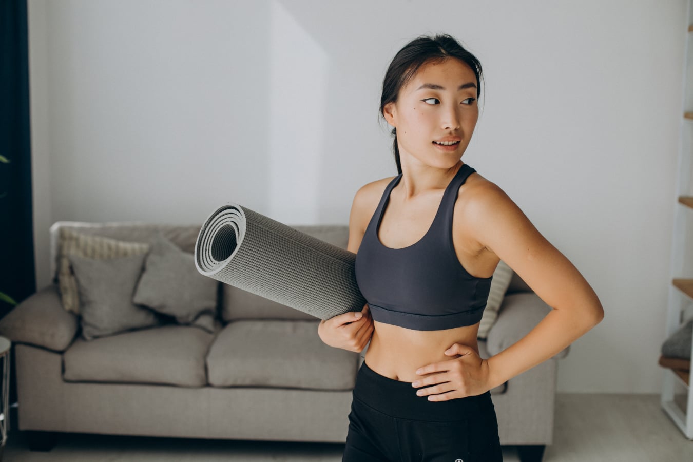 Women with gastroparesis holding a yoga mat
