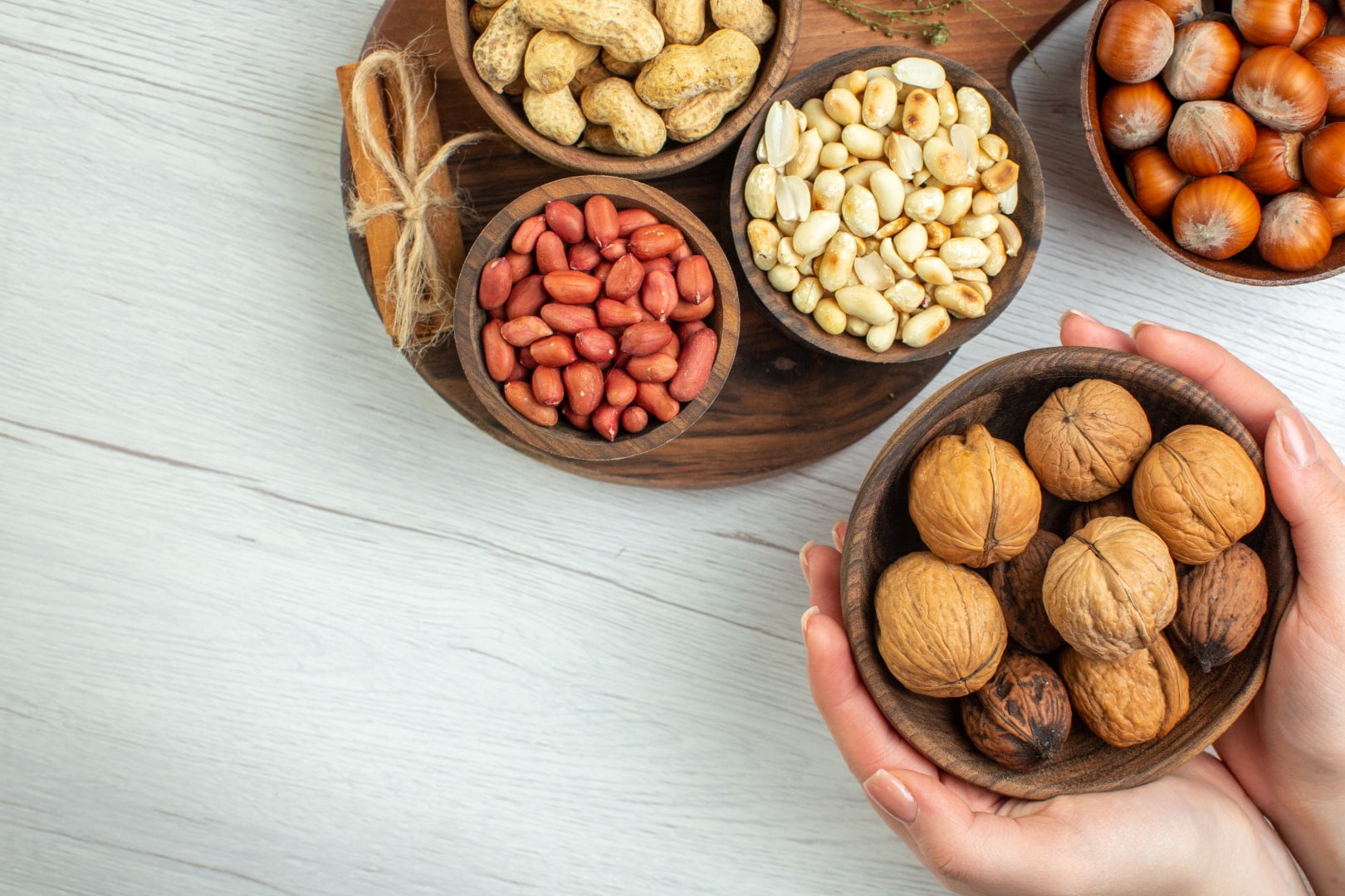Different kinds of nuts in a bowl that may trigger heartburn