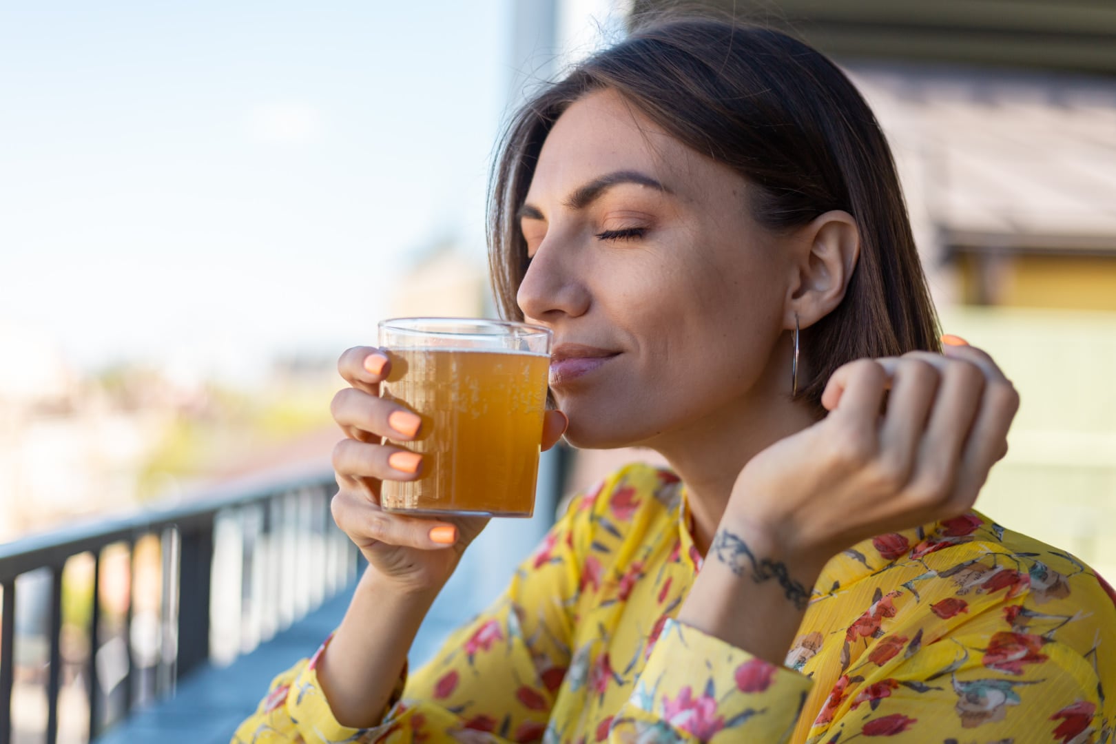Woman with hiatal hernia drinking ginger tea in the morning