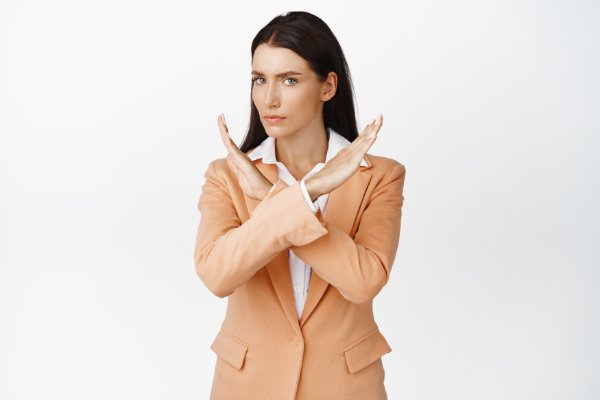 Person with hiatal hernia doing cross gesture with her hands