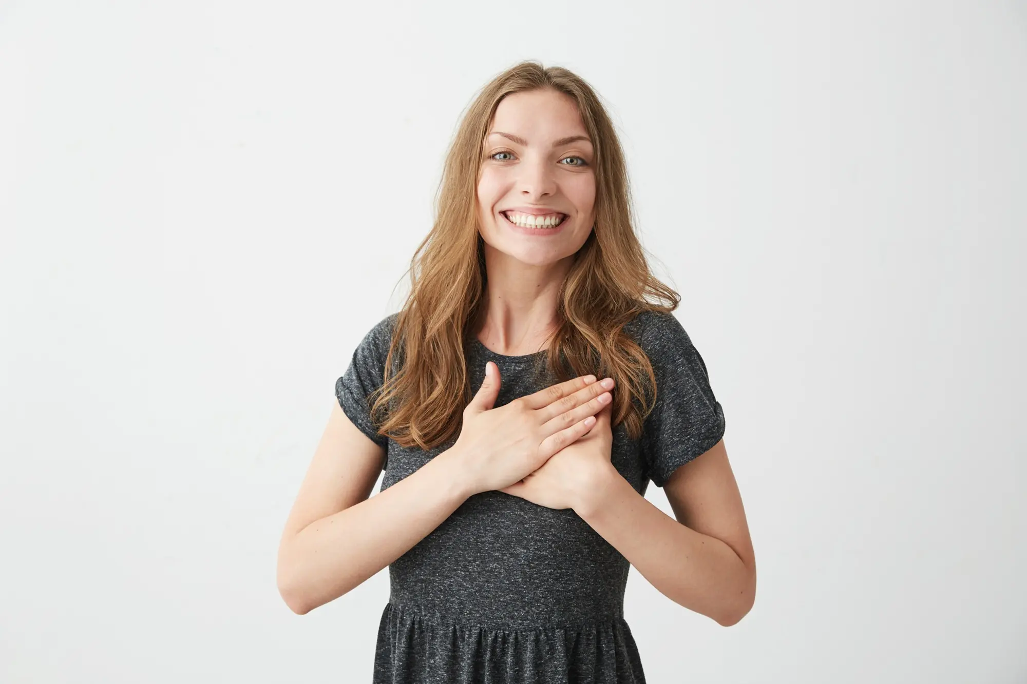 portrait tender happy young girl smiling holding hands heart
