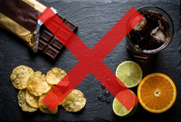 Acid reflux trigger snacks to avoid including chocolate, chips, soda, and citrus