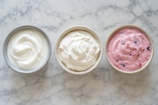 Plain, Greek, and flavored yogurt side by side, comparing choices for acid reflux and heartburn