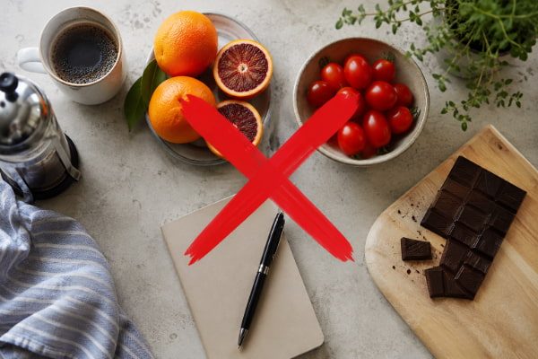 Common acid reflux trigger foods with a symptom tracking notebook