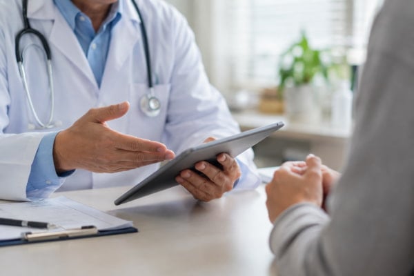 Physician reviewing heartburn and reflux treatment options with a patient in Tampa
