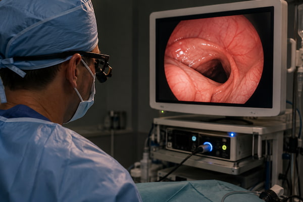 Surgeon reviewing endoscopic imaging while performing a TIF procedure for GERD