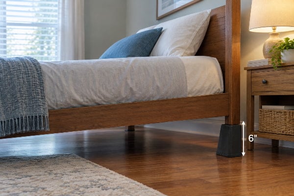 Bed riser lifting the head-end leg six inches to reduce nighttime acid reflux