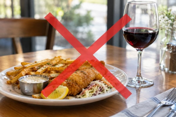 Fried food and alcohol on a table, the two heartburn triggers with the strongest evidence