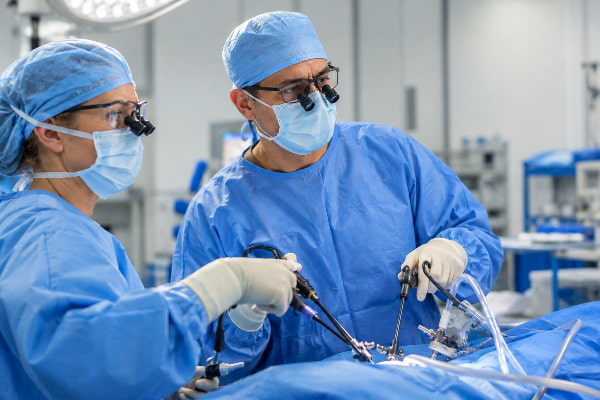 Surgeons performing laparoscopic hiatal hernia repair to reduce reflux after sleeve