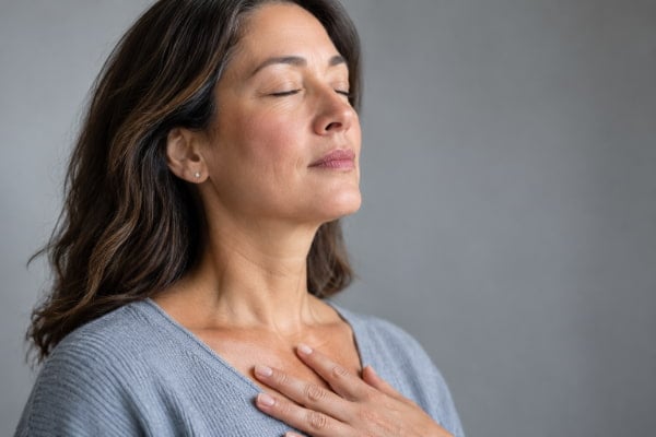 Woman struggling to inhale from silent reflux and shortness of breath